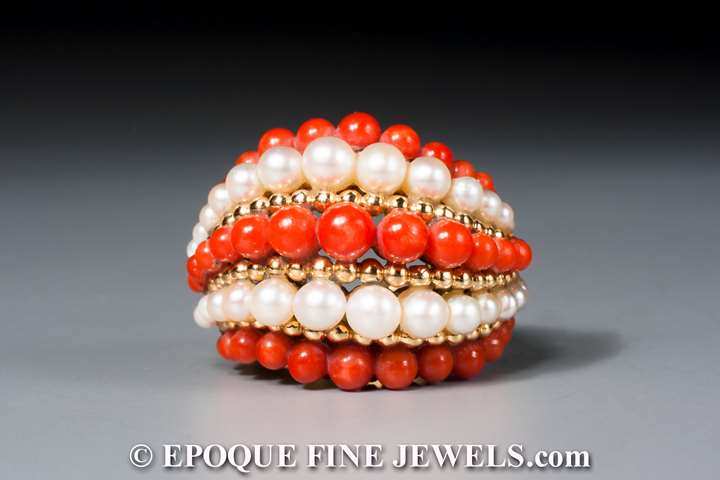 An 18 karat gold, pearl and coral bombé ring